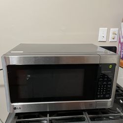 Stainless Steel and Black 1.1 cu Microwave