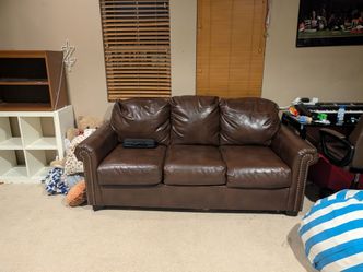 Faux brown leather pull out couch
