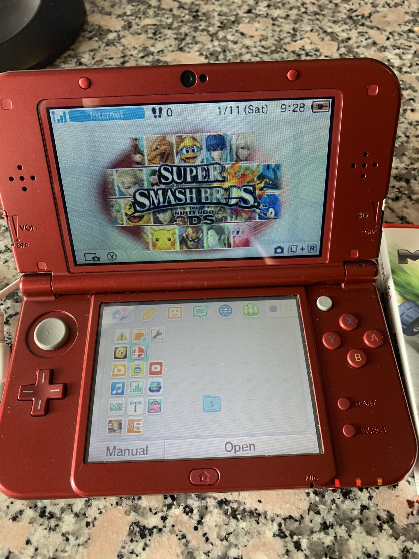 Red Nintendo 3DS with games
