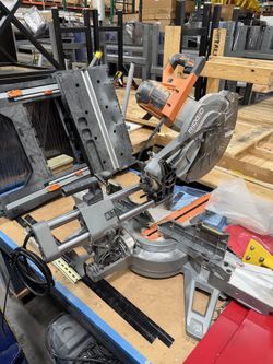 Rigid sliding compound miter saw