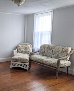 Vintage White Wicker Chair and Ottoman with Tan Wicker Loveseat and Floral Cushions