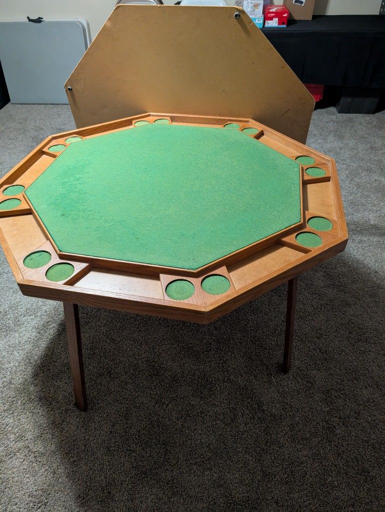 Folding Poker Table With A Table Top Cover And Chairs