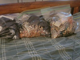 THREE LARGE BAGS OF MISCELLANEOUS JEWELRY AND MISCELLANEOUS ITEMS