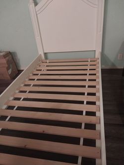 Twin size XL solid wood bed frame, cream color, in excellent condition. Serious inquiries only.