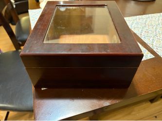 Humidor small but holds at least 25 nice sized Cigars