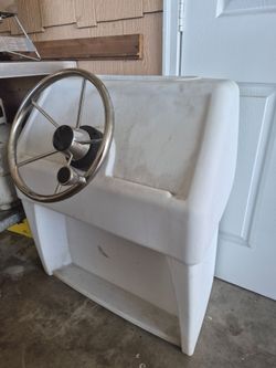 Boat center console with steering wheel