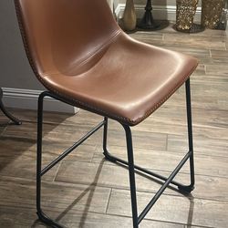 Stylish black Or Brown leather bar stool with metal frame.