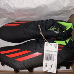 These are Adidas X Speedportal.1 Firm Ground (FG) soccer cleats in the Black/Solar Red colorway (model GW8429).
