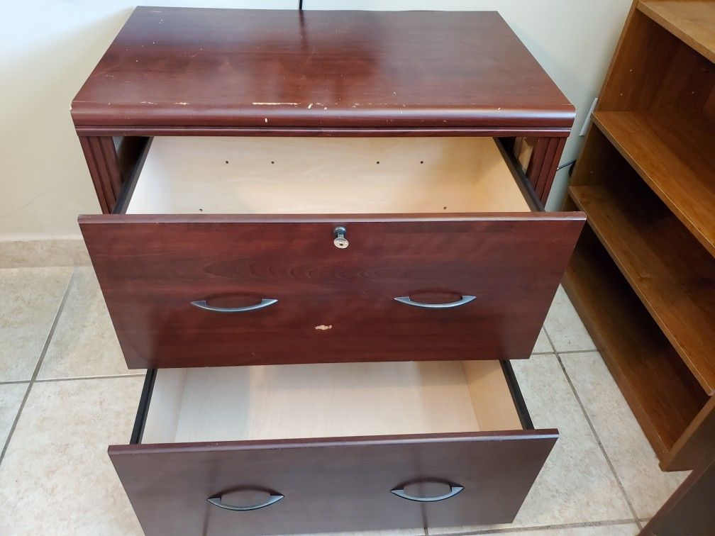 2 drawer file cabinet with key. Laminate wood.