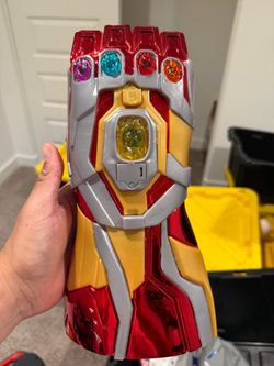 Iron man hand with stones