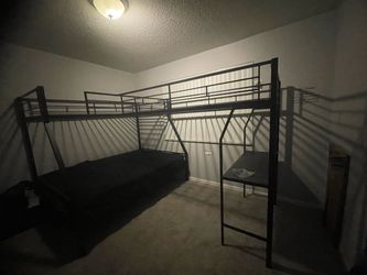 Triple bunk bed with desk