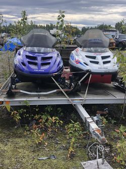 Two old sleds on trailer