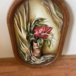 Flower made of leather in a frame