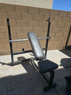 Incline/Decline Bench Press w/ leg extension and preacher connections. Adjustable squat rack/pull down.