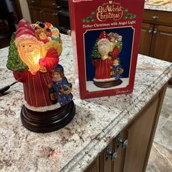 Old world, father Christmas with angel light