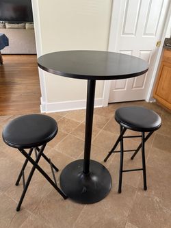 Tall round table with stools