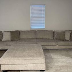 Beige Couch And Ottoman 
