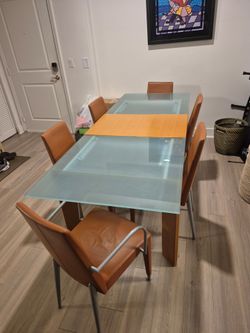 Italian made dinning set (6 leather chairs)