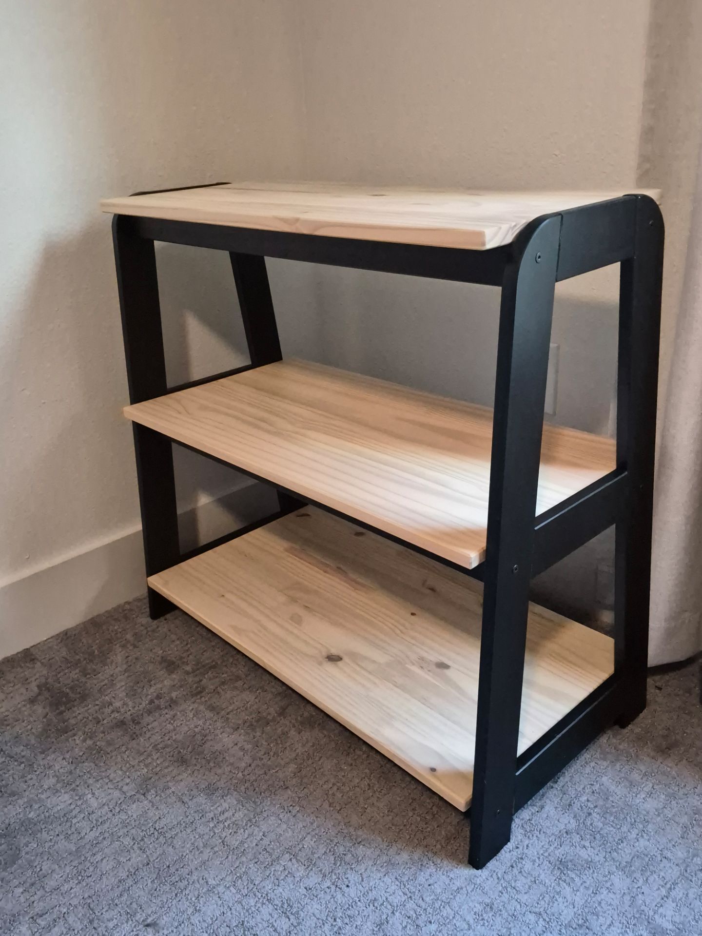 Wooden shelf with black frame