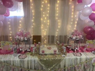 Baby shower decoration table and balloons arch