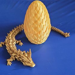 3D Printed Gold Dragon Egg With Gold Dragon Flexible Fidget Toy