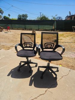 2 black office chairs