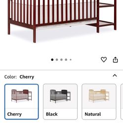 Baby crib with changing table