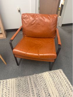 Midcentury modern faux leather chairs