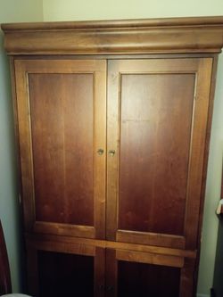 Large brown wooden cabinet