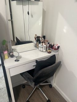 White vanity with mirror slide with storage