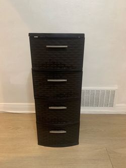 Durable plastic storage tower has four drawers with a dark brown espresso weave pattern. This unit features silver-colored pull handles on each drawer