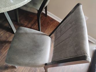 Five Chairs And A Table 