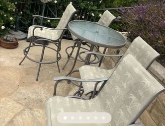 4 chairs and a table- high top