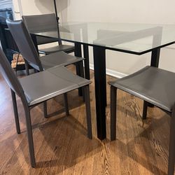 Glass top dining Table With Black Metal Base