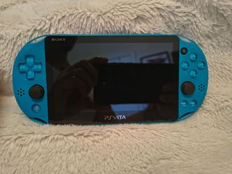 PlayStation Vita blue (hardly used)