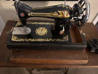vintage Singer Sewing Machine featuring the iconic gold "Sphinx"