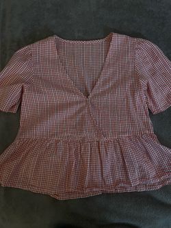 checkered orange and white blouse