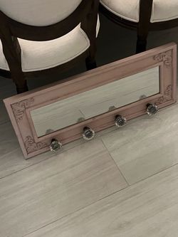 Entryway mirror with large knobs for hanging