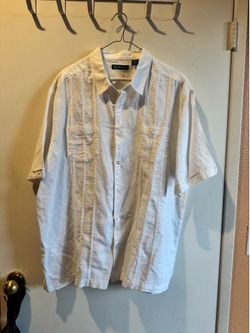 Cubavera Relaxed short-sleeve button-down with classic Cuban styling. Vertical stitched panels for subtle texture. Two chest pockets for easy storage.