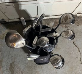 Random golf clubs and bag