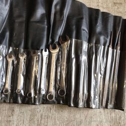 Various Wrenches And Files With Tool Wrap