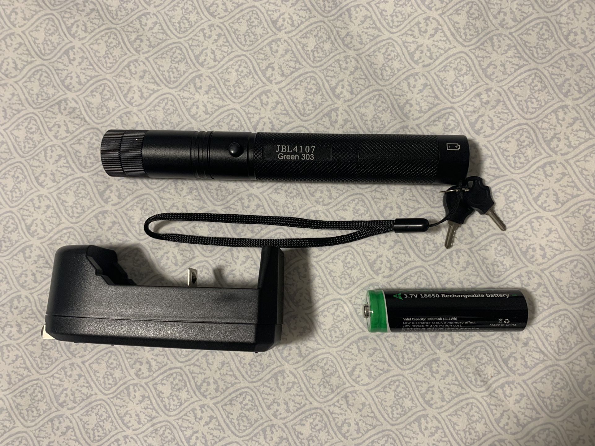 Very Powerful Burning Green Laser Pointer with battery, charger, star cap, and safety keys feature