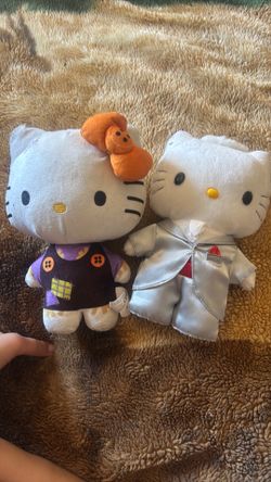 A Halloween hello Kitty plushy and a groomsmen hello Kitty