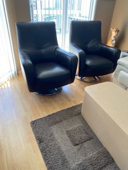Chocolate Brown leather swivel chairs on chrome bases. H39" W31"