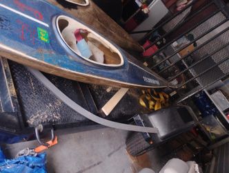 Two Racing Kayaks Very Shallow One Fiberglass One Plastic 