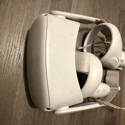 Meta Quest 2 standalone VR headset and controllers. 