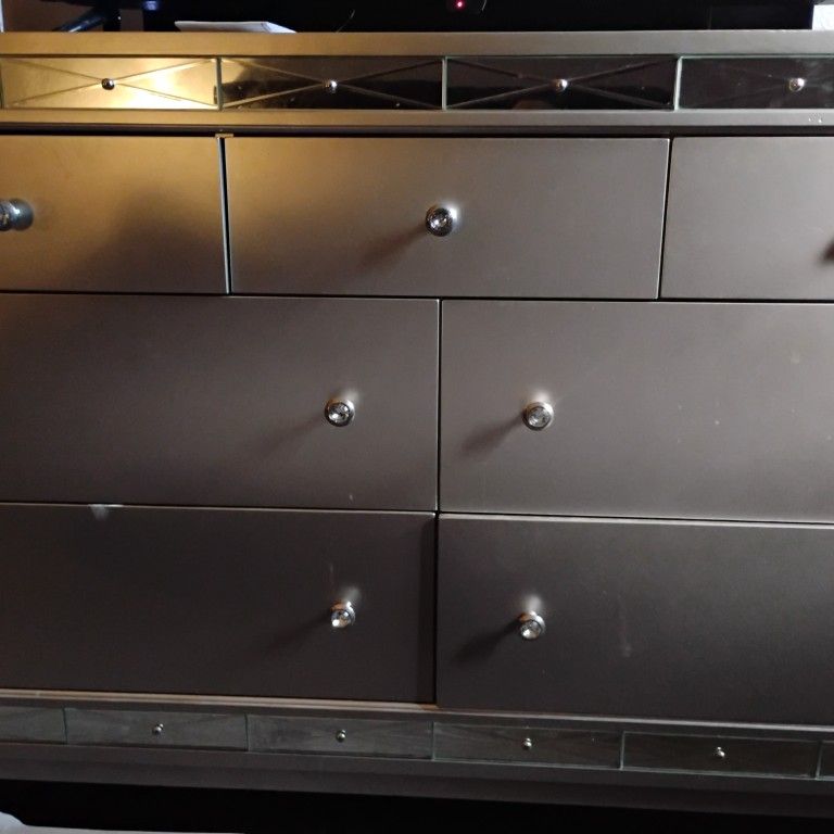 Dresser And Nightstand And A Mirror