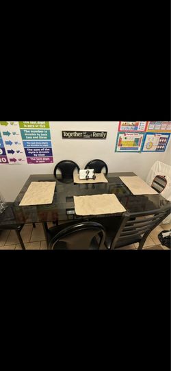 Dining Table- glass top and 4 matching chairs