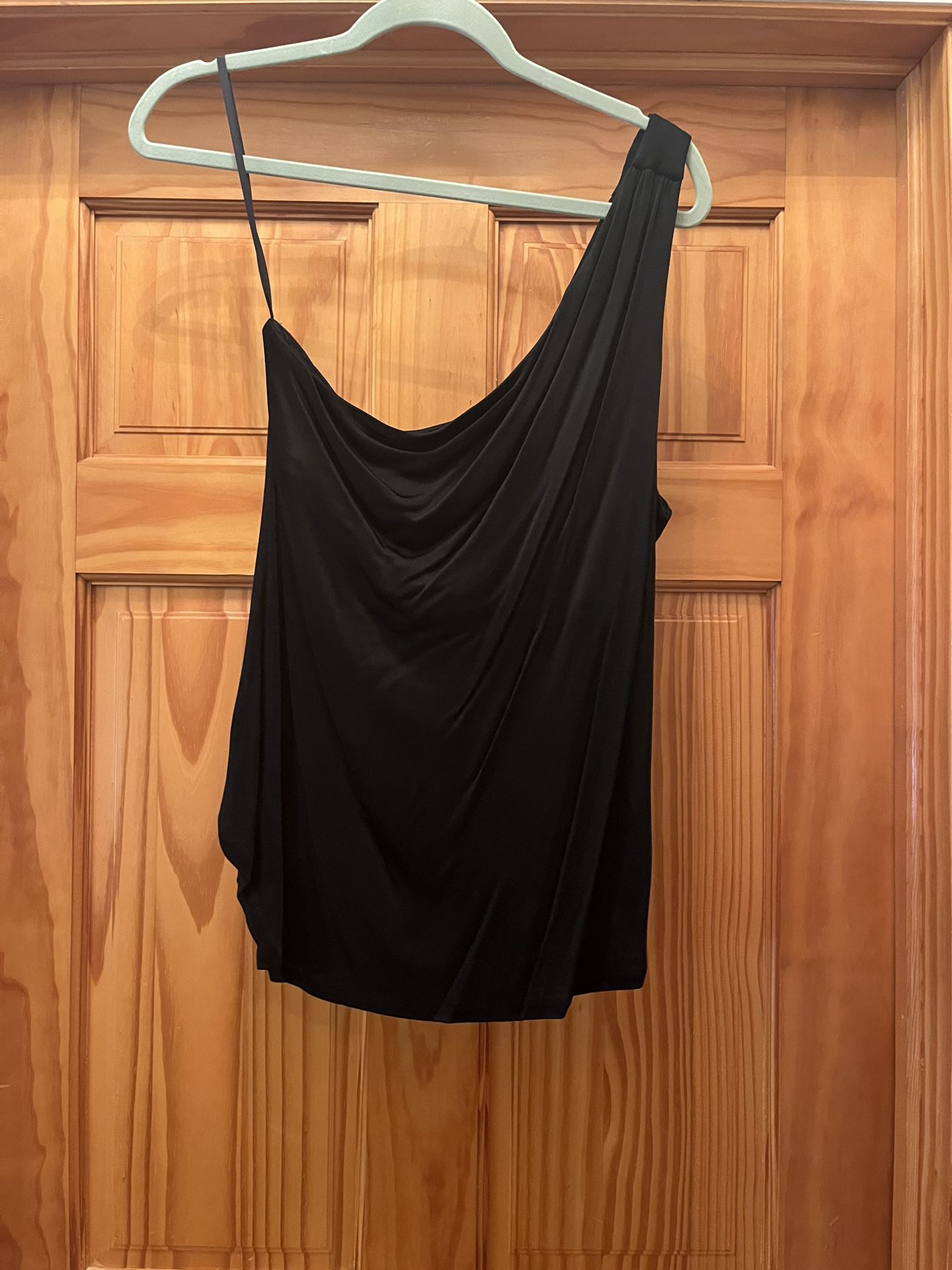 One shoulder strap top. Very pretty. Color black. Stretchy material. Size XL