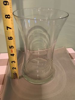 Large tall thick glass vase with unique shape, weighted bottom to help with tip over.